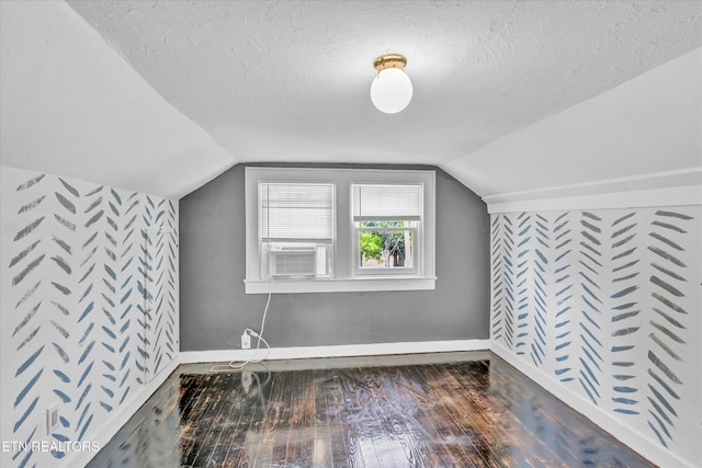 4616 Coile Rd, Knoxville, TN 37918 - additional living space with hardwood / wood-style flooring, a textured ceiling, lofted ceiling, and cooling unit