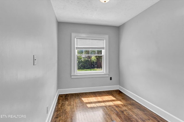 4616 Coile Rd, Knoxville, TN 37918 - empty room featuring dark wood-type flooring and a textured ceiling