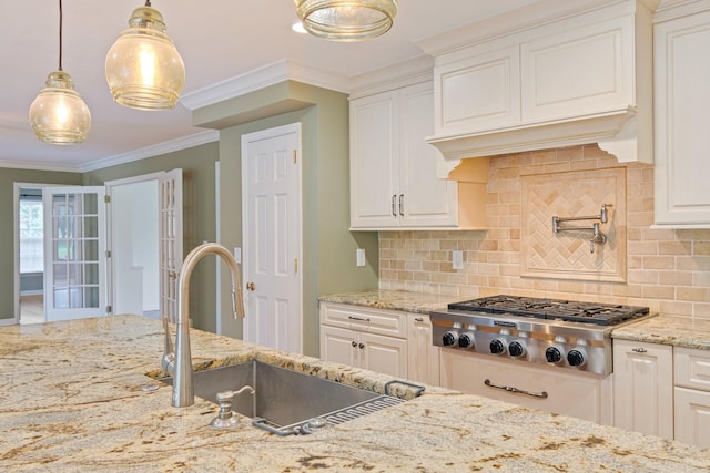 1111 Chickasaw Dr, Brentwood, TN 37027 - kitchen featuring stainless steel gas cooktop, decorative backsplash, light stone counters, crown molding, and premium range hood