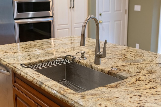 1111 Chickasaw Dr, Brentwood, TN 37027 - kitchen featuring double oven and light stone countertops