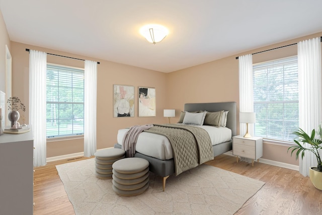 1111 Chickasaw Dr, Brentwood, TN 37027 - bedroom featuring light wood-style flooring and multiple windows