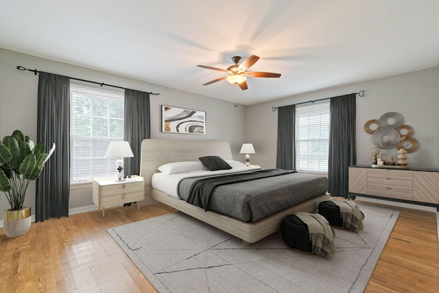 1111 Chickasaw Dr, Brentwood, TN 37027 - bedroom with multiple windows, wood finished floors, and ceiling fan