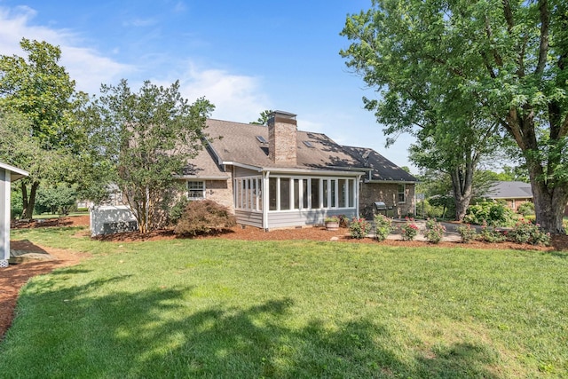 1111 Chickasaw Dr, Brentwood, TN 37027 - rear view of house featuring a chimney, a sunroom, a lawn, and a shingled roof