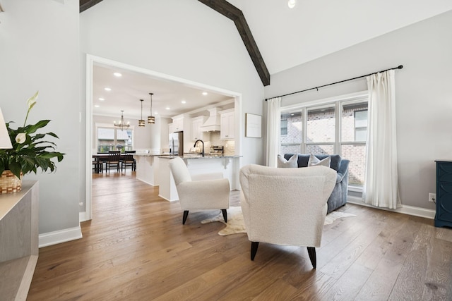 1037 Jackston Mack Way, Gallatin, TN 37066 - dining area with beamed ceiling, wood finished floors, a chandelier, high vaulted ceiling, and recessed lighting