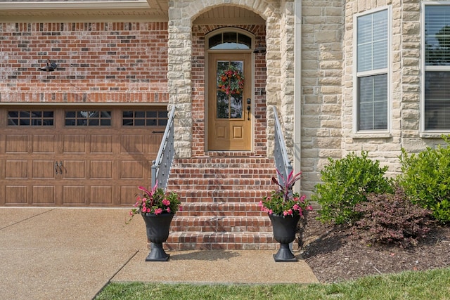 1037 Jackston Mack Way, Gallatin, TN 37066 - view of exterior entry with brick siding, driveway, and stone siding