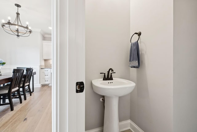 1037 Jackston Mack Way, Gallatin, TN 37066 - bathroom with a chandelier, ornamental molding, and wood finished floors