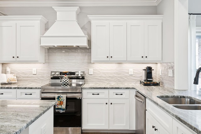 1037 Jackston Mack Way, Gallatin, TN 37066 - kitchen with appliances with stainless steel finishes, custom range hood, white cabinetry, decorative backsplash, and crown molding