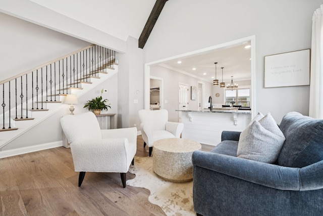 1037 Jackston Mack Way, Gallatin, TN 37066 - living room featuring wood finished floors, recessed lighting, stairs, a chandelier, and ornamental molding