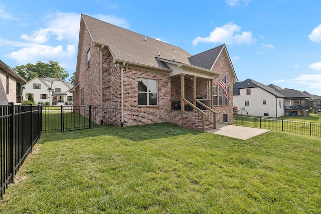 1037 Jackston Mack Way, Gallatin, TN 37066 - back of house featuring brick siding, a patio area, a shingled roof, and a fenced backyard
