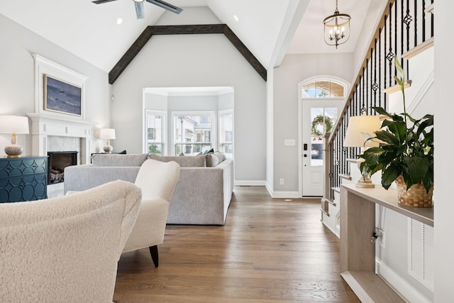 1037 Jackston Mack Way, Gallatin, TN 37066 - foyer entrance featuring stairway, a chandelier, high vaulted ceiling, wood finished floors, and beam ceiling