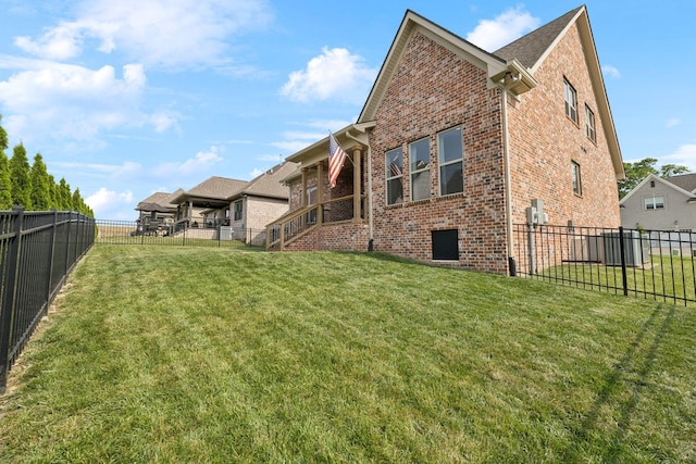 1037 Jackston Mack Way, Gallatin, TN 37066 - rear view of house with brick siding and a fenced backyard