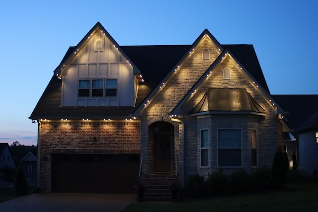1037 Jackston Mack Way, Gallatin, TN 37066 - view of front of property featuring a garage, concrete driveway, stone siding, and brick siding