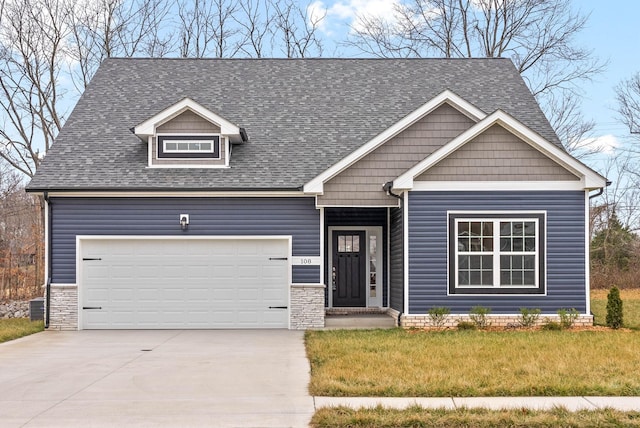 108 Hummingbird Way, Clarksville, TN 37043 - craftsman-style home with concrete driveway, roof with shingles, a front yard, and an attached garage