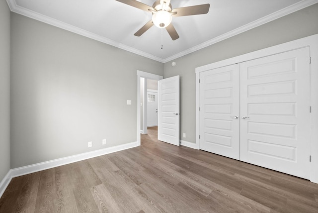 108 Hummingbird Way, Clarksville, TN 37043 - unfurnished bedroom with wood finished floors, ornamental molding, a closet, and ceiling fan