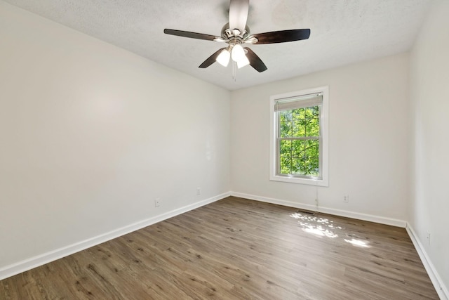 853 Hornbuckle Rd, Clarksville, TN 37043 - unfurnished room with wood finished floors, ceiling fan, and a textured ceiling