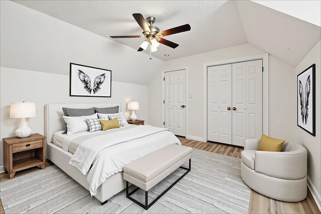 853 Hornbuckle Rd, Clarksville, TN 37043 - bedroom featuring lofted ceiling, two closets, light wood-style flooring, and a ceiling fan
