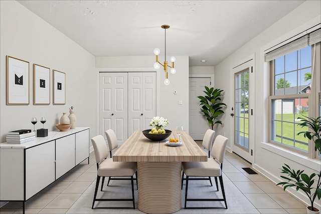 853 Hornbuckle Rd, Clarksville, TN 37043 - dining space with light tile patterned floors and a chandelier
