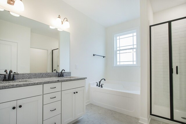 4024 Rampart Way, Spring Hill, TN 37174 - bathroom with a bath, double vanity, a stall shower, and tile patterned flooring