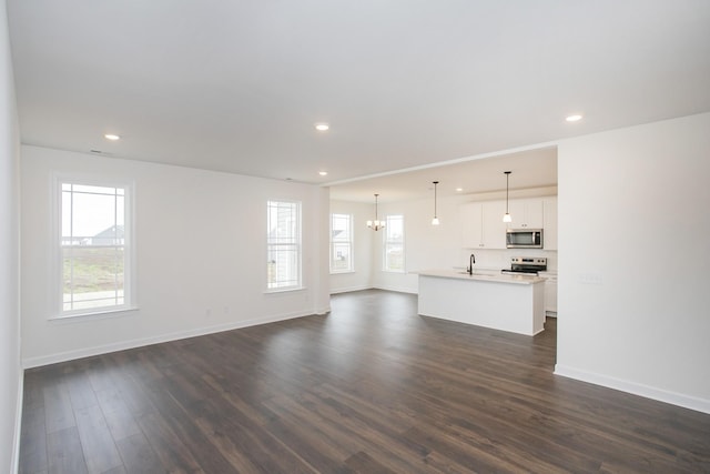 4024 Rampart Way, Spring Hill, TN 37174 - unfurnished living room with dark wood-style flooring, recessed lighting, and a chandelier