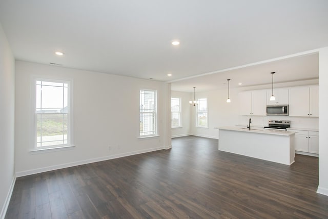4024 Rampart Way, Spring Hill, TN 37174 - unfurnished living room featuring dark wood-type flooring, a chandelier, and recessed lighting