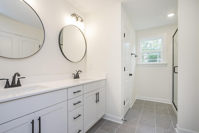 4022 Rampart Way, Spring Hill, TN 37174 - bathroom featuring double vanity, a stall shower, and tile patterned flooring