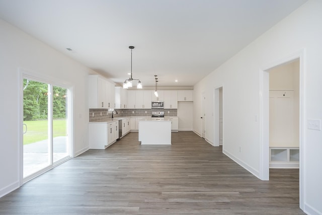 4022 Rampart Way, Spring Hill, TN 37174 - kitchen with stainless steel appliances, backsplash, light countertops, white cabinets, and recessed lighting