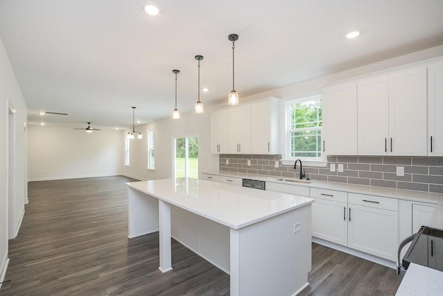 4022 Rampart Way, Spring Hill, TN 37174 - kitchen with tasteful backsplash, a center island, dishwasher, white cabinetry, and light countertops