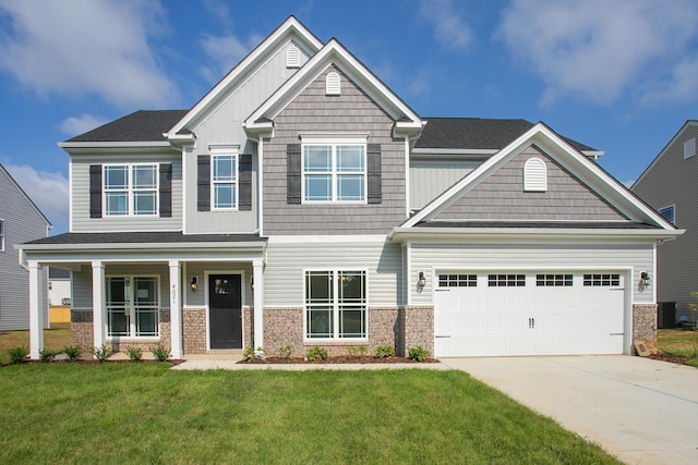 4022 Rampart Way, Spring Hill, TN 37174 - craftsman house featuring driveway, a front lawn, an attached garage, board and batten siding, and brick siding