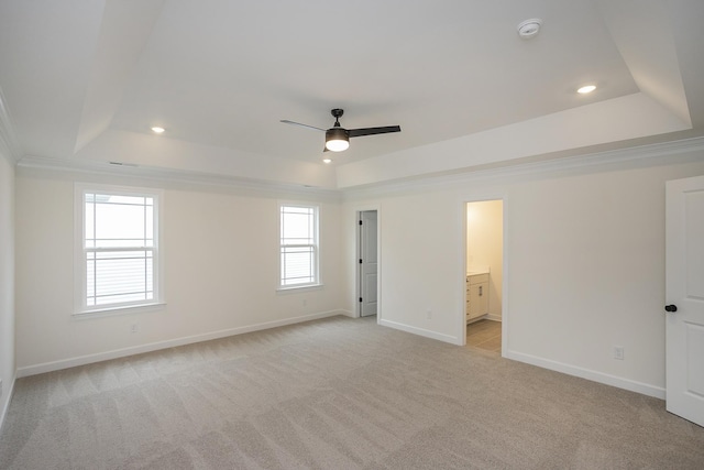 4022 Rampart Way, Spring Hill, TN 37174 - unfurnished bedroom with a tray ceiling, light carpet, recessed lighting, ornamental molding, and ensuite bath