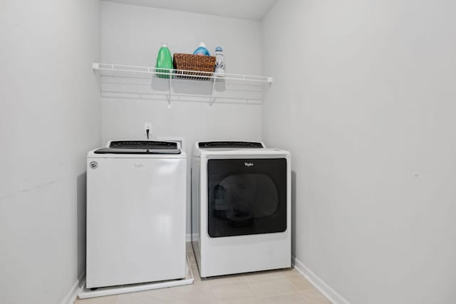 3276 Holiday Ln, Columbia, TN 38401 - washroom with independent washer and dryer and light tile patterned floors