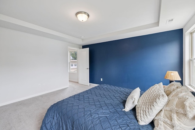 3276 Holiday Ln, Columbia, TN 38401 - carpeted bedroom featuring baseboards and a tray ceiling