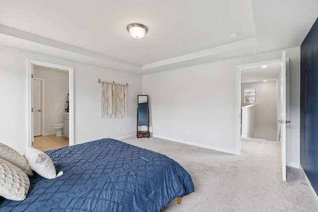 3276 Holiday Ln, Columbia, TN 38401 - bedroom with a raised ceiling, ensuite bathroom, and carpet floors
