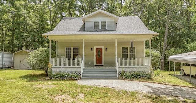 730 Carlew Rd, Waynesboro, TN 38485 - bungalow-style home with a porch, a shed, a front yard, and roof with shingles