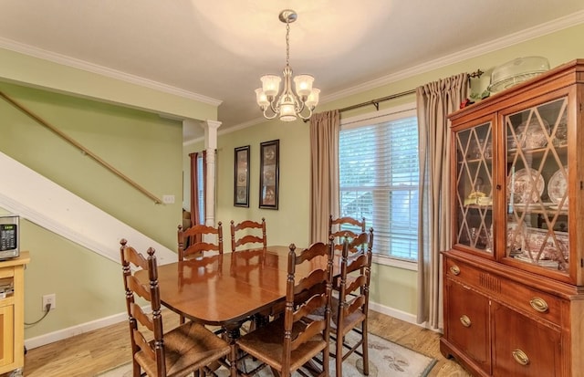 730 Carlew Rd, Waynesboro, TN 38485 - dining space with light wood-style floors, crown molding, and a chandelier