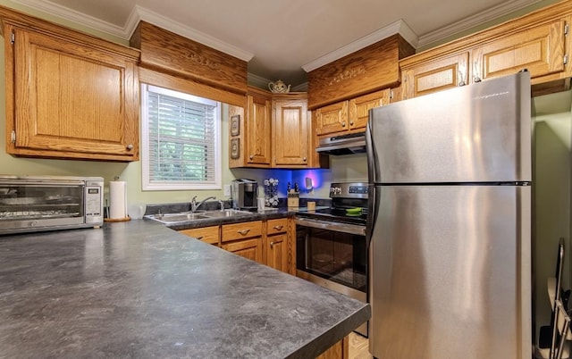 730 Carlew Rd, Waynesboro, TN 38485 - kitchen with appliances with stainless steel finishes, ornamental molding, under cabinet range hood, dark countertops, and brown cabinetry