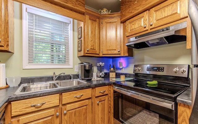730 Carlew Rd, Waynesboro, TN 38485 - kitchen with stainless steel electric range oven, under cabinet range hood, dark countertops, and brown cabinets