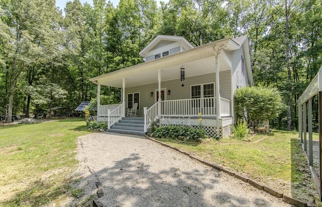 730 Carlew Rd, Waynesboro, TN 38485 - view of front of home featuring covered porch, a front yard, and view of wooded area