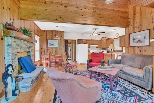 110 Village Way, Lancaster, TN 38569 - living area with wooden walls, light wood finished floors, healthy amount of natural light, a ceiling fan, and wooden ceiling