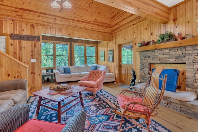 110 Village Way, Lancaster, TN 38569 - living area featuring wood finished floors, wood walls, lofted ceiling, and stairs