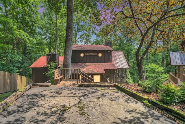 110 Village Way, Lancaster, TN 38569 - chalet / cabin featuring a chimney, a metal roof, and stairs