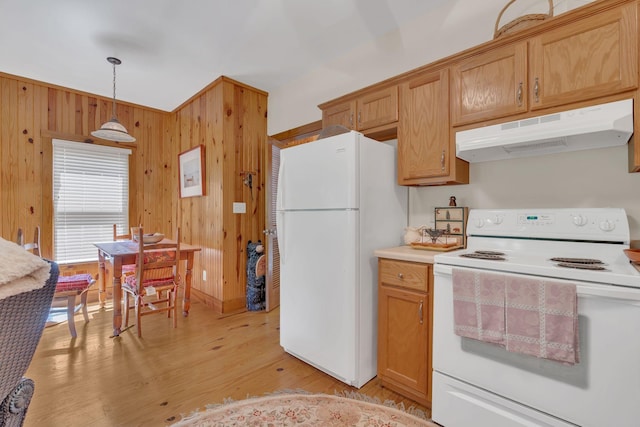 110 Village Way, Lancaster, TN 38569 - kitchen with white appliances, under cabinet range hood, light wood finished floors, wooden walls, and light countertops