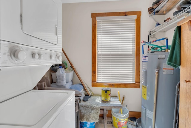 110 Village Way, Lancaster, TN 38569 - laundry room featuring electric water heater and stacked washing machine and dryer