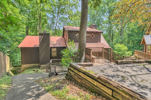 110 Village Way, Lancaster, TN 38569 - back of property with a chimney and a wooden deck