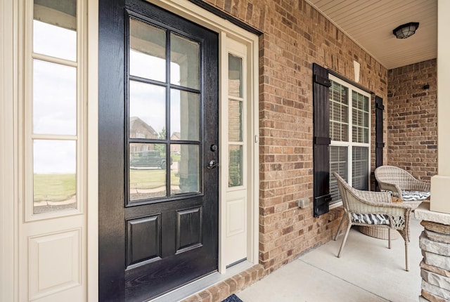 2018 Via Francesco Ct, Spring Hill, TN 37174 - doorway to property featuring a porch and brick siding
