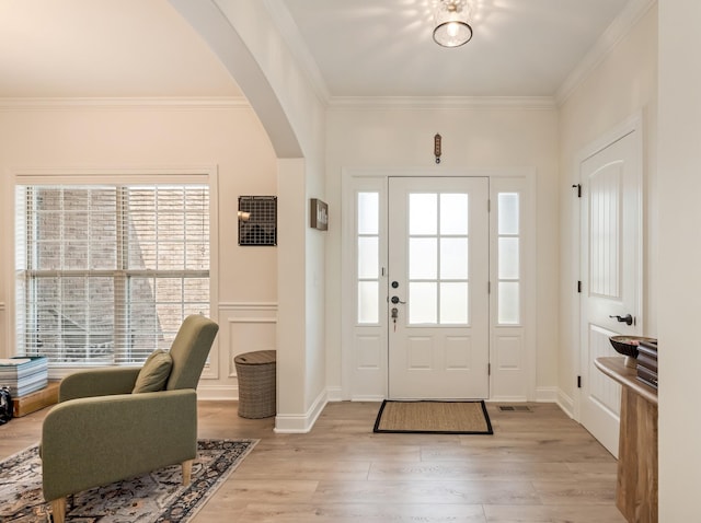 2018 Via Francesco Ct, Spring Hill, TN 37174 - entrance foyer with arched walkways, healthy amount of natural light, light wood-style flooring, and ornamental molding