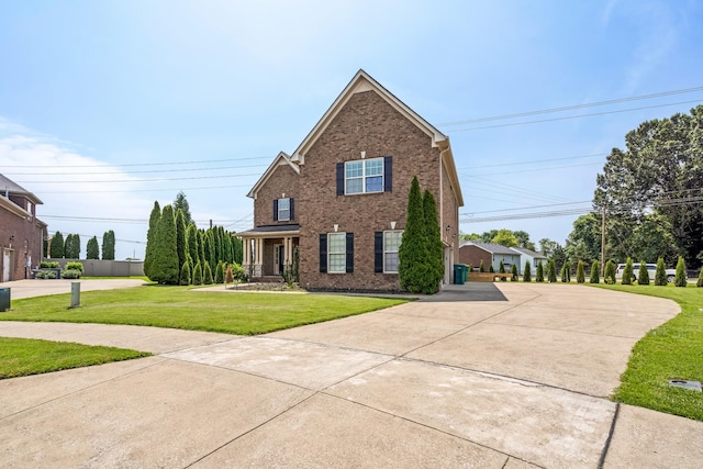 2018 Via Francesco Ct, Spring Hill, TN 37174 - traditional-style home with a front lawn, brick siding, and concrete driveway