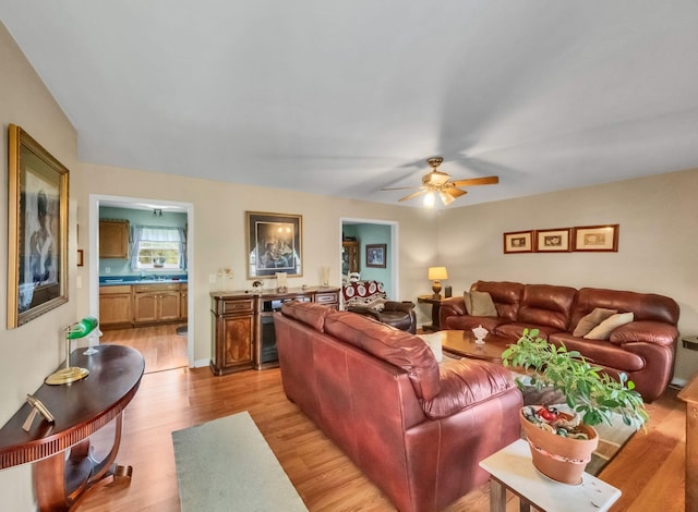 1611 London Dr, Columbia, TN 38401 - living room featuring beverage cooler, light wood-type flooring, and ceiling fan