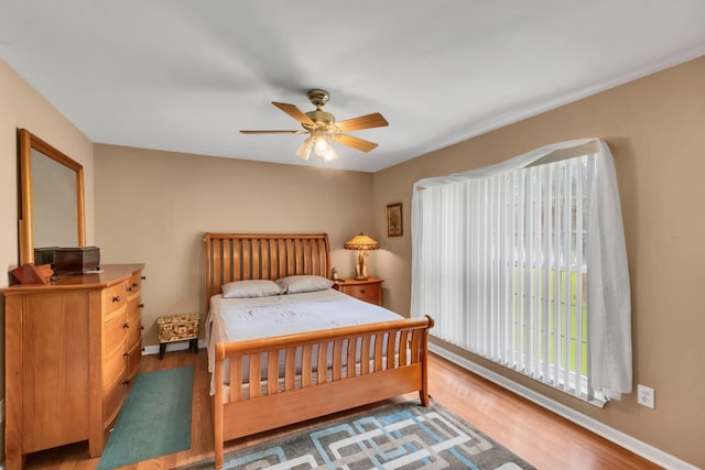 1611 London Dr, Columbia, TN 38401 - bedroom with wood finished floors, multiple windows, and a ceiling fan