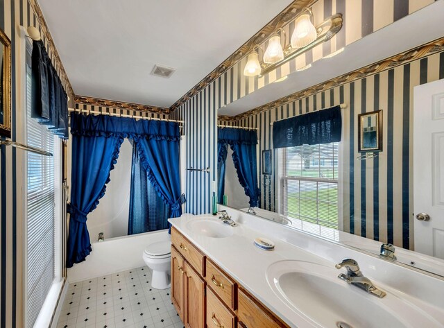 1611 London Dr, Columbia, TN 38401 - full bathroom with wallpapered walls, double vanity, shower / bath combination with curtain, and tile patterned floors