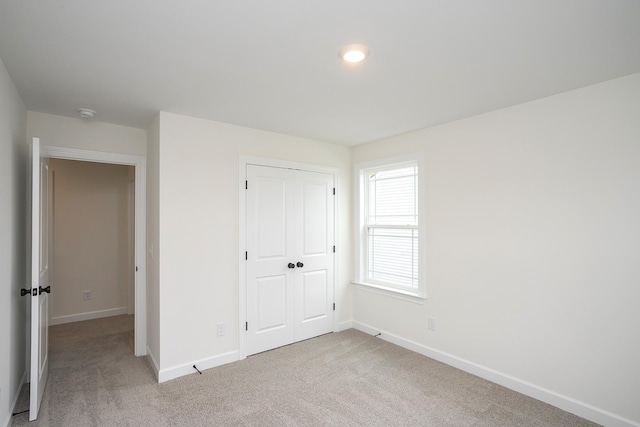 4018 Rampart Way, Spring Hill, TN 37174 - unfurnished bedroom featuring light colored carpet and a closet